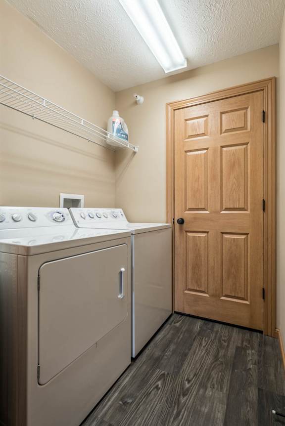 a washer and dryer in a laundry room with a door