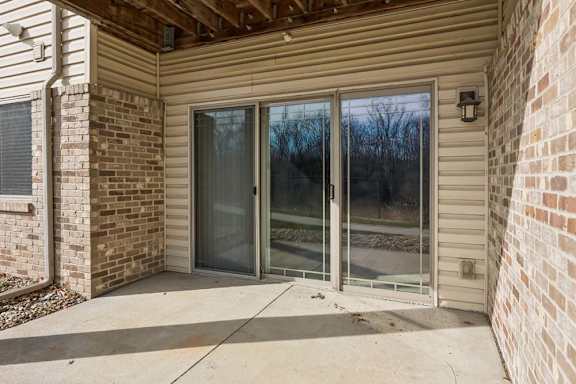 A glass door is on the right side of a house.