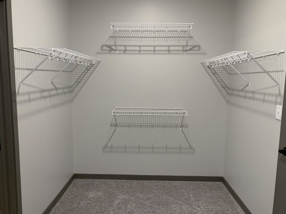 Walk in closet with hanging and shelving space at haven at uptown