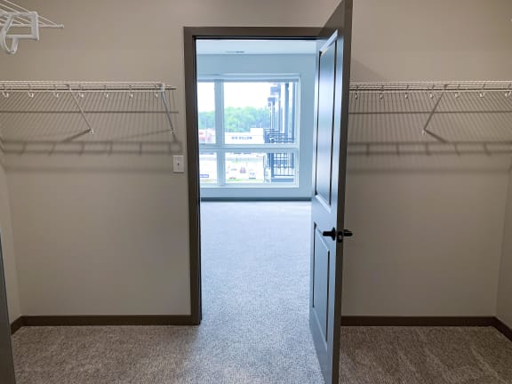 View from the walk in closet to the bedroom at haven at uptown
