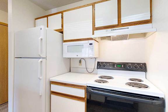 Kitchen appliances including refrigerator, microwave, and stove