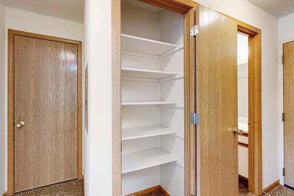 A pantry closet with open shelving