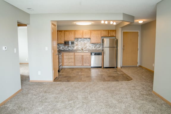 Open concept view of living room into renovated kitchen