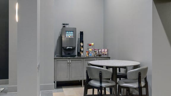 Lobby at Midtown Crossing Apartments in Omaha Nebraska featuring plenty of seating and a coffee station