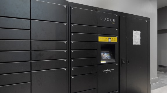 Luxer package locker system providing safe and secure package drop off and pick up at midtown crossing apartments