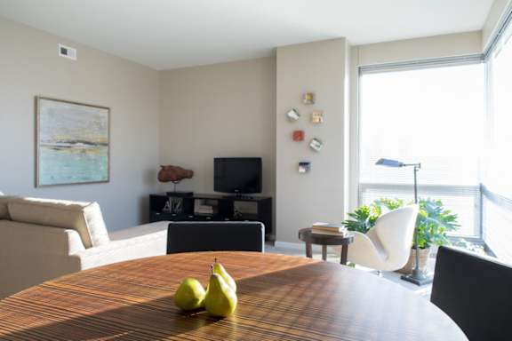 living room and dining space with huge corner windows