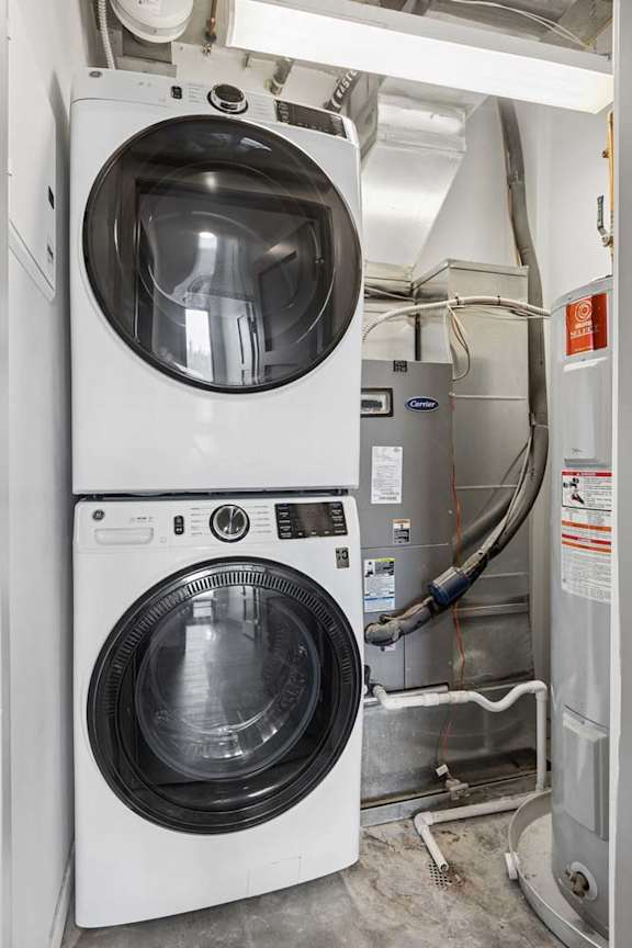 A front load stacked full sized washer and dryer