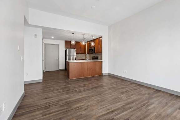 A kitchen with a wooden island in the middle of the room.