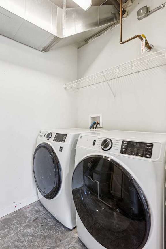 A laundry room with a full-sized side-by-side washer and dryer.
