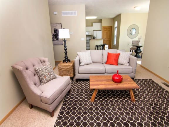 furnished living room with small couch and chair