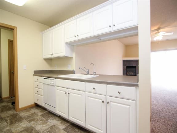 Galley Style Kitchen with white upper and lower cabinets
