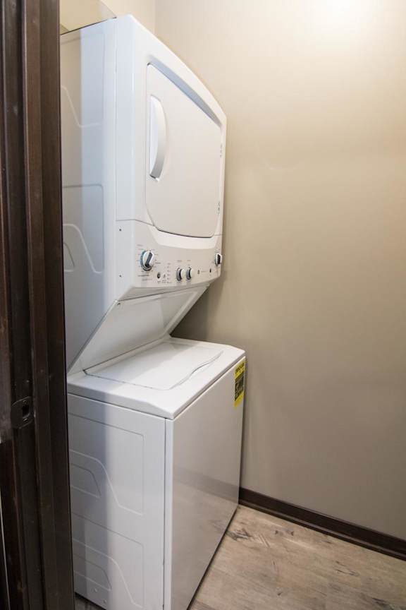 A white washing machine in a small room.