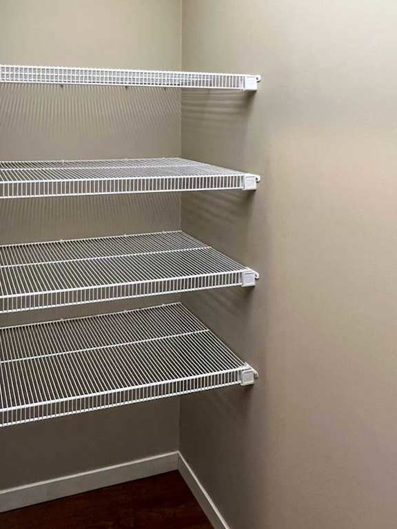a pantry with built-in shelving