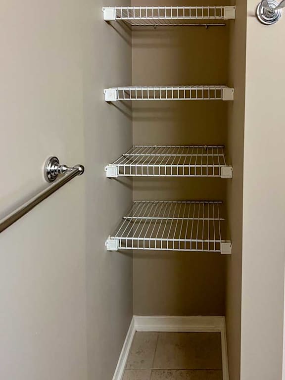 built-in shelves in the bathroom for linens