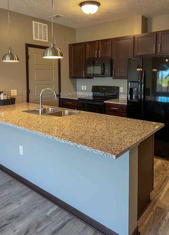a kitchen with a granite counter top and a sink
