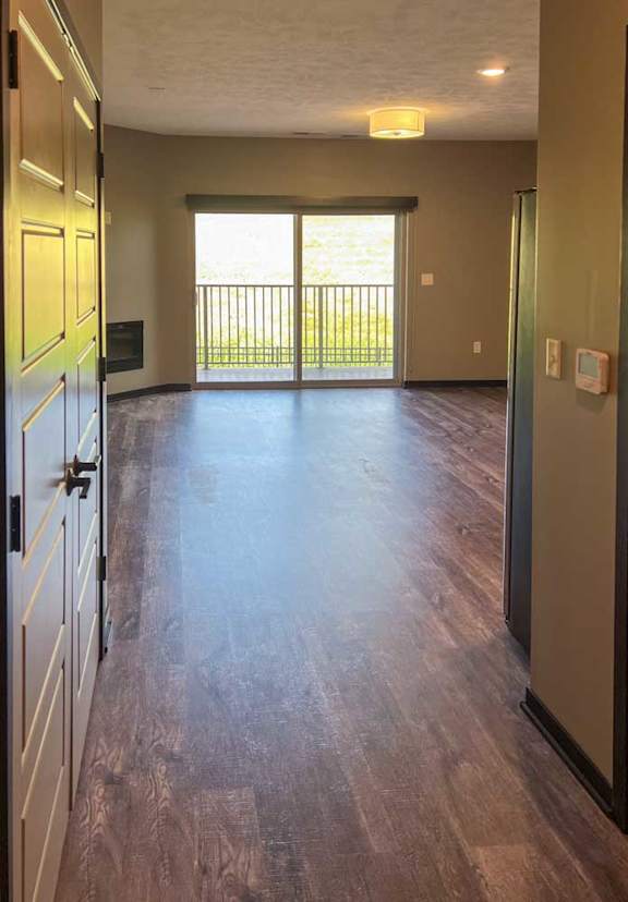 a view of the living room balcony sliding glass door from the front entryway