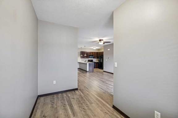 A room with wooden floors and white walls.
