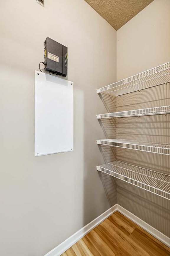 A rack of white wire closet shelves