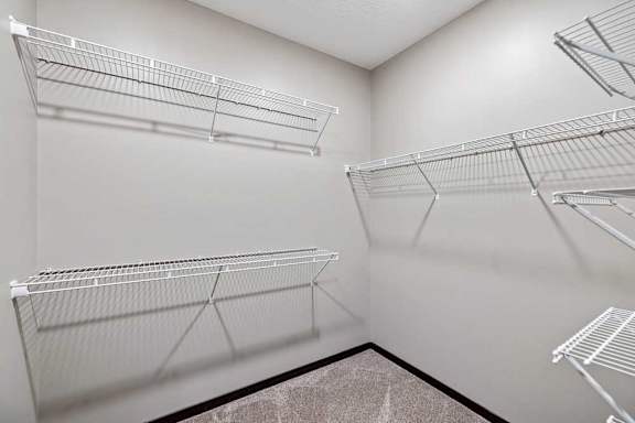 Empty shelves in a room with white walls.