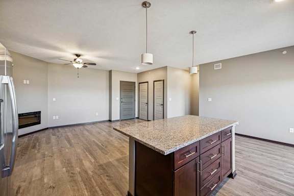 A kitchen with a counter and cabinets.