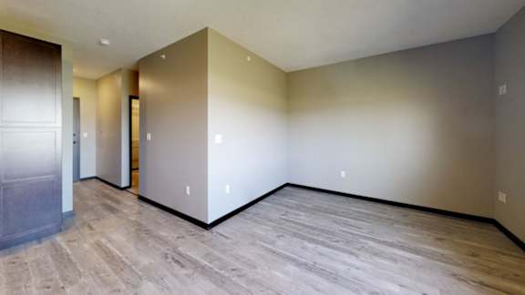 a living room with wooden flooring