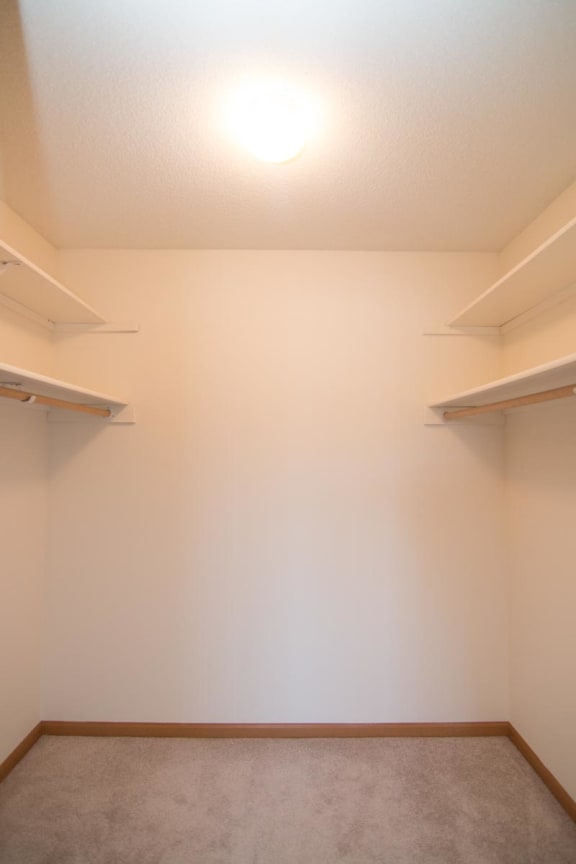 a empty room with shelves on the wall