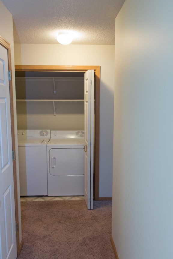 a laundry room with a washer and dryer in it