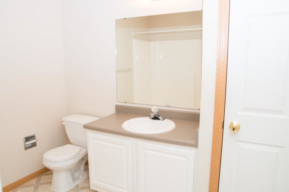 a bathroom with a toilet and a sink