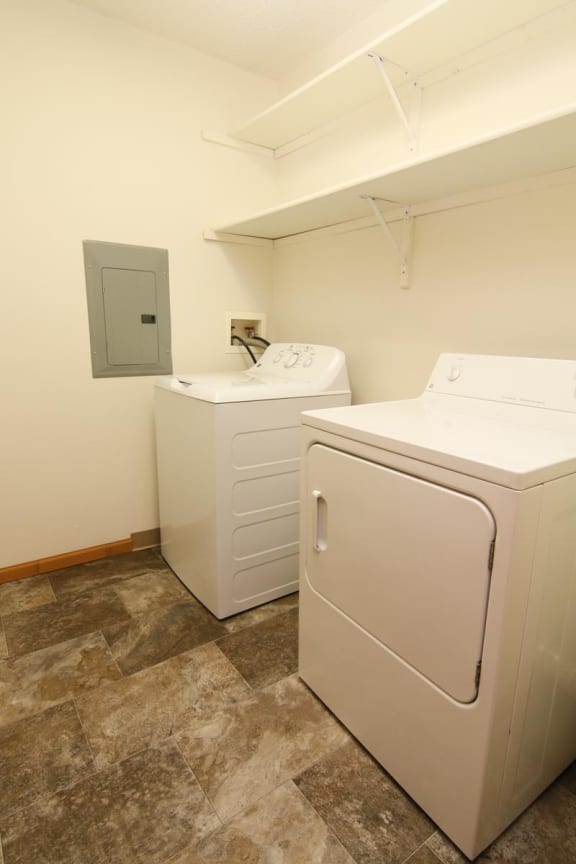 a laundry room with a washer and a dryer in it