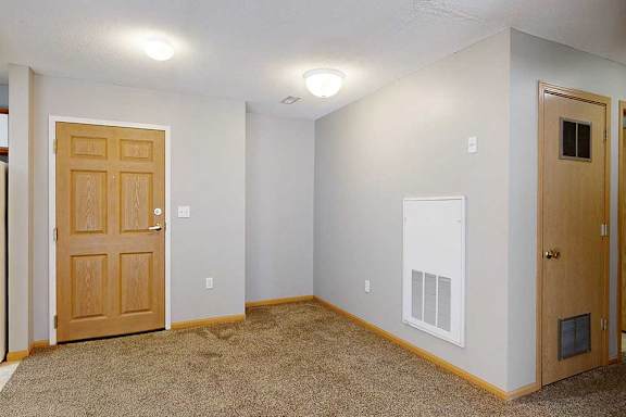 entry with a brown carpet