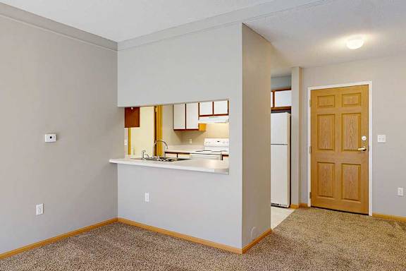 galley style kitchen area with a counter with room for seating
