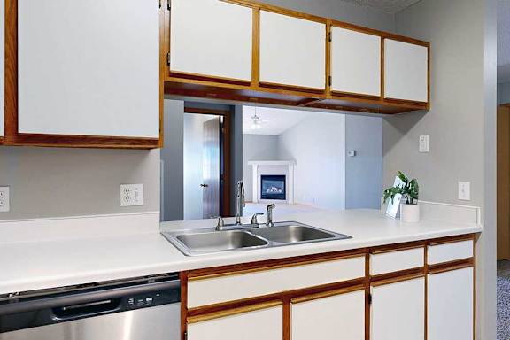 kitchen with a white countertop and white cabinets.