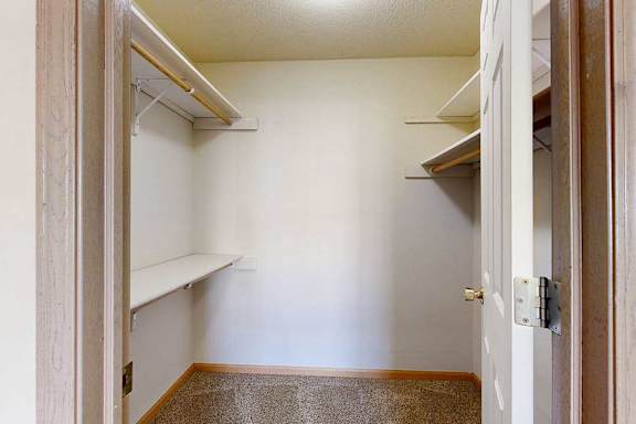 large walk-in closets with a shelving and storage