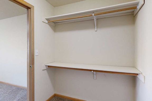 large walk-in closets with a shelving and storage