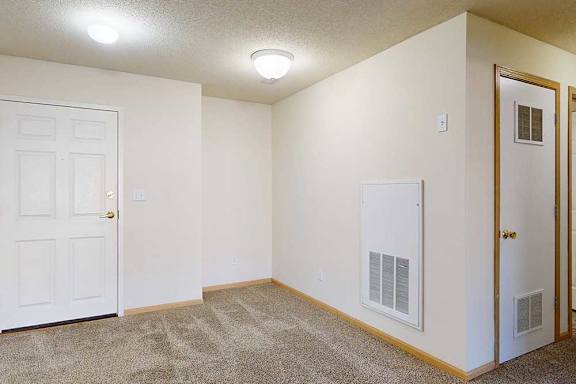 carpeted dining and entry area