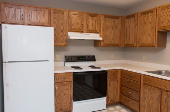 a kitchen with a stove and a refrigerator