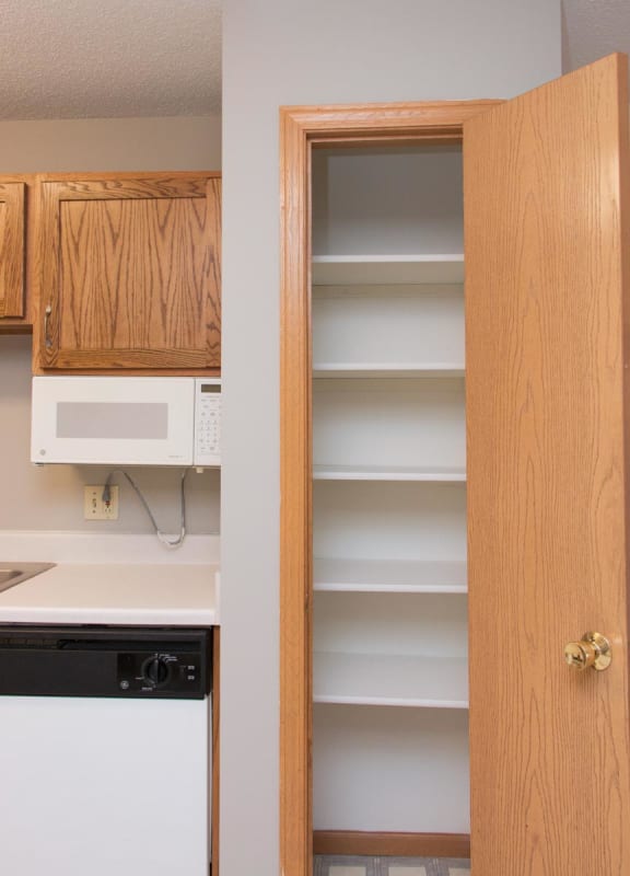 a kitchen with a cabinet and a microwave in it