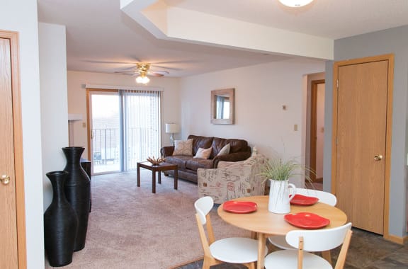 a living room with a dining room table and a couch