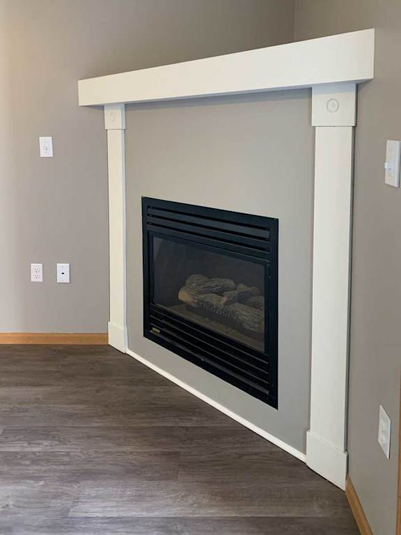a fireplace with a grey and white mantle