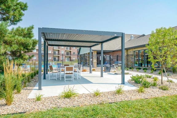Covered outdoor seating and dining area with modern furniture