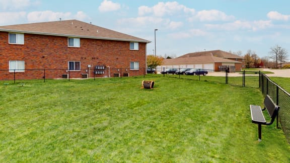 Large fenced dog park with grass at Northridge Heights apartments in Lincoln