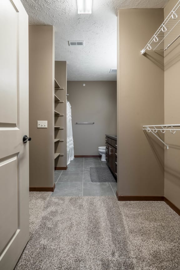a large walk in closet in a bedroom