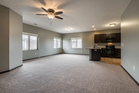 Large living space with kitchen at The Villas of Omaha at Butler Ridge in Omaha Nebraska
