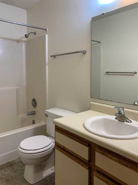 a bathroom with a white vanity sink a mirror and a shower