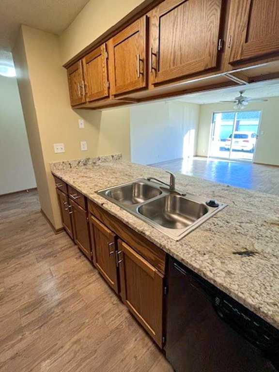 a kitchen with wooden cabinets and updated countertops