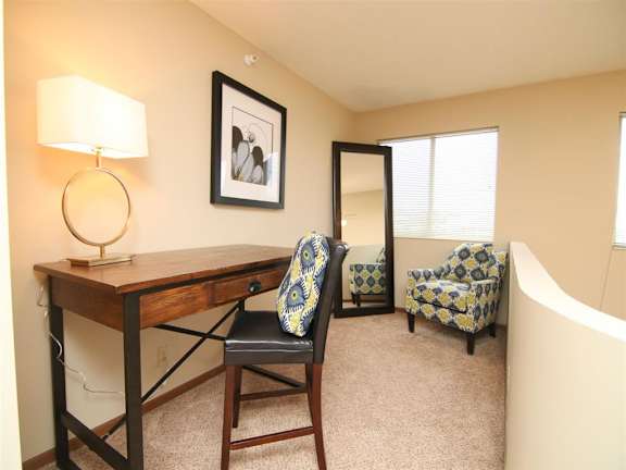 desk area at in lofted bedroom