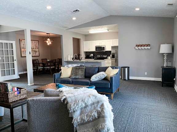 apartment clubhouse with a couch and a table
