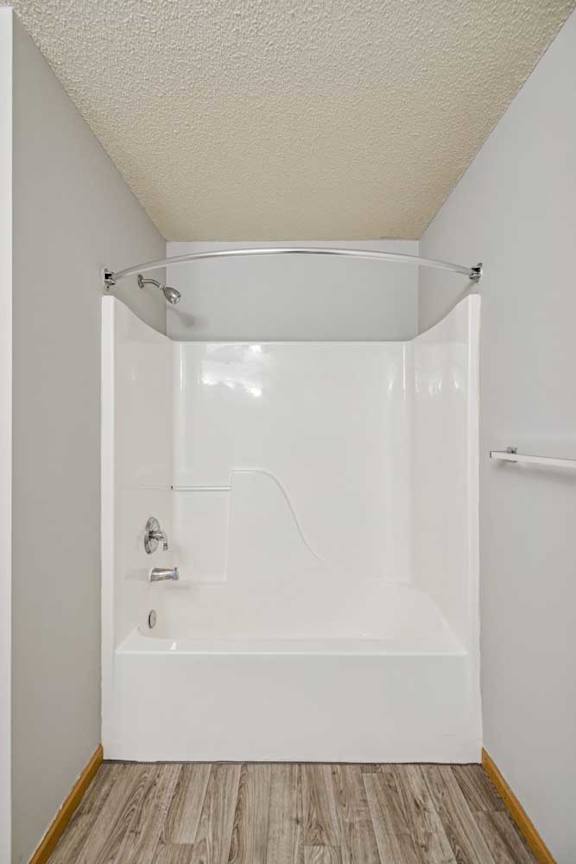 A white bathroom with a walk-in shower.