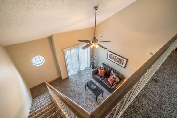 View from top loft of apartment into the living room below