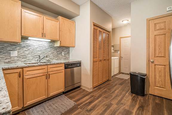 Upgraded unit with stainless-steel appliances and kitchen backsplash at Southwind Villas in La Vista, NE